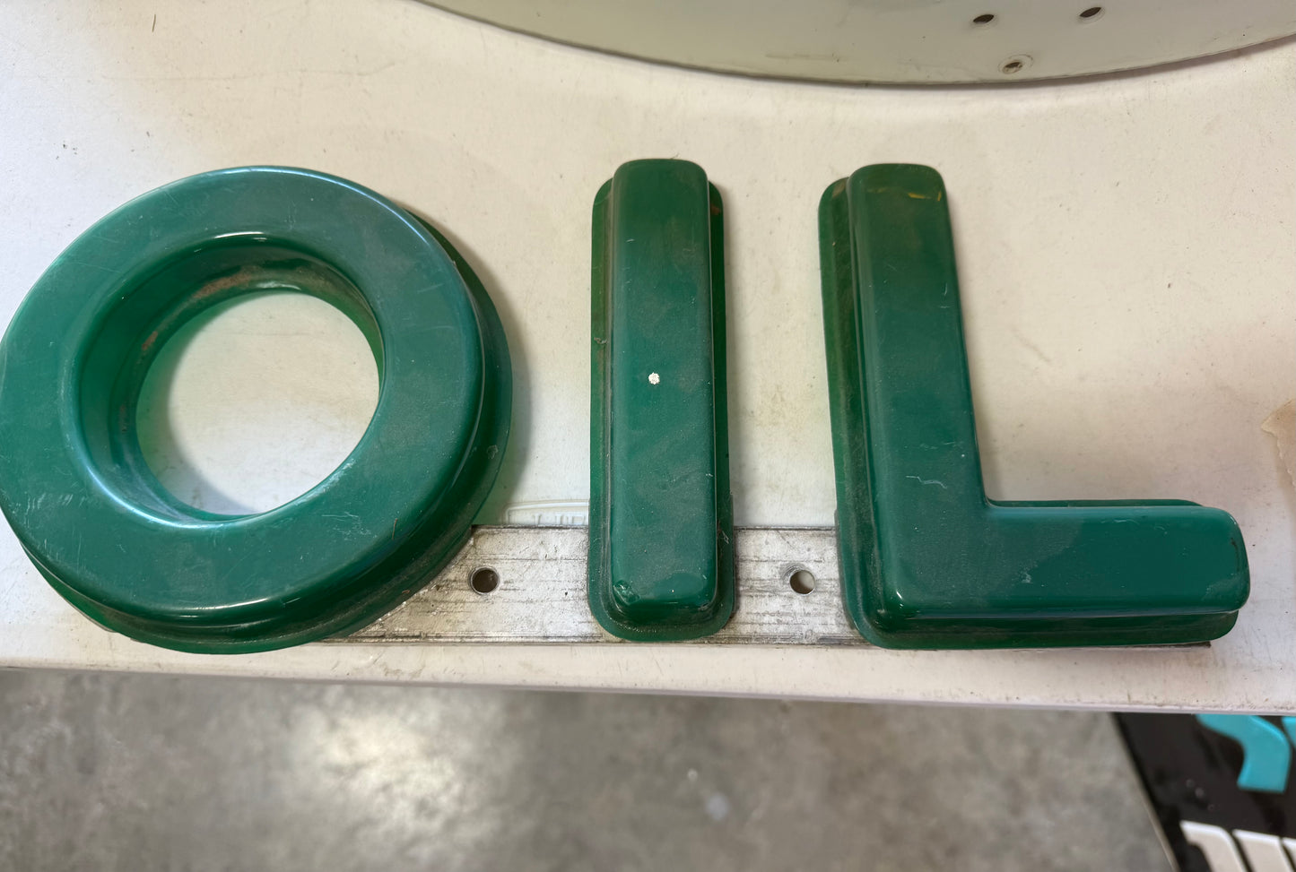 OIL mounted letters