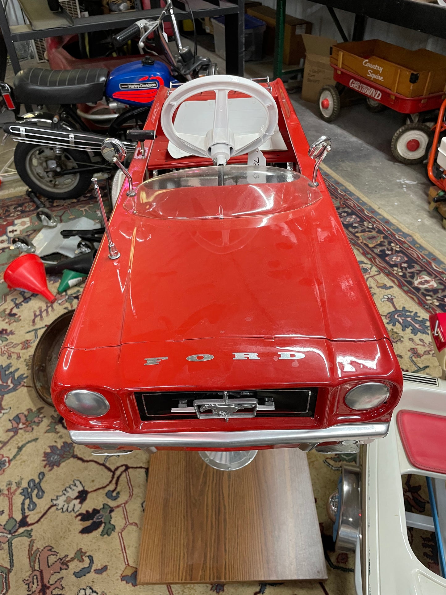 Restored AMF Ford Mustang Pedal Car on Stand