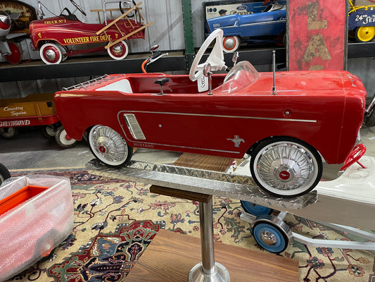 Restored AMF Ford Mustang Pedal Car on Stand