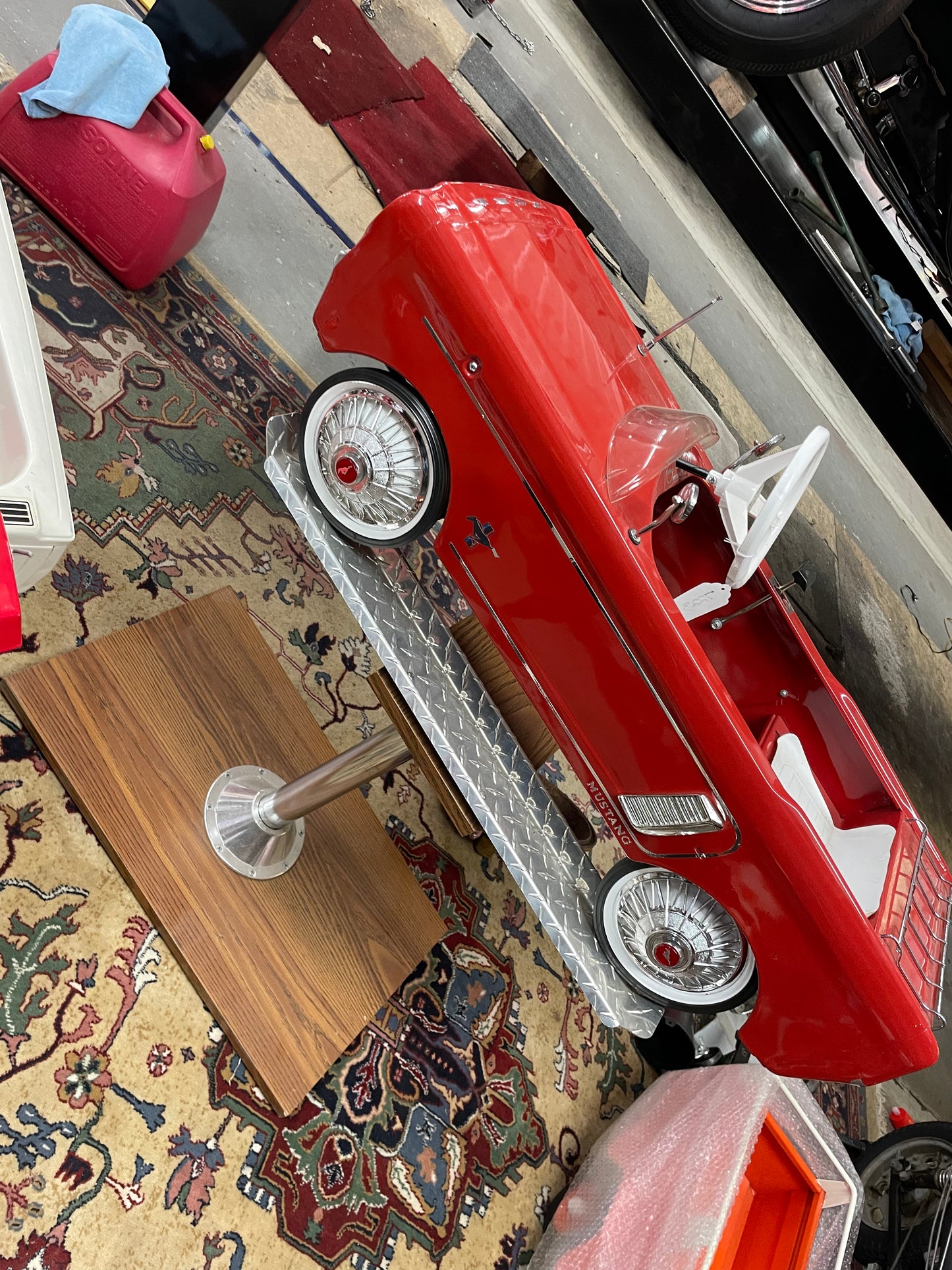 Restored AMF Ford Mustang Pedal Car on Stand