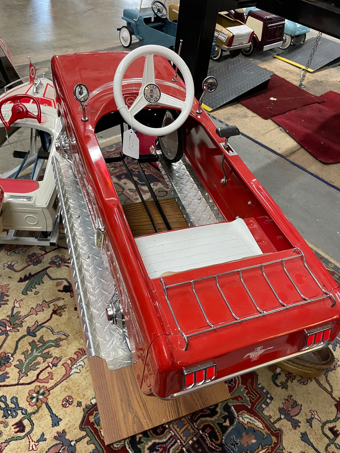 Restored AMF Ford Mustang Pedal Car on Stand
